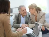 Elderly couple planning with a lawyer